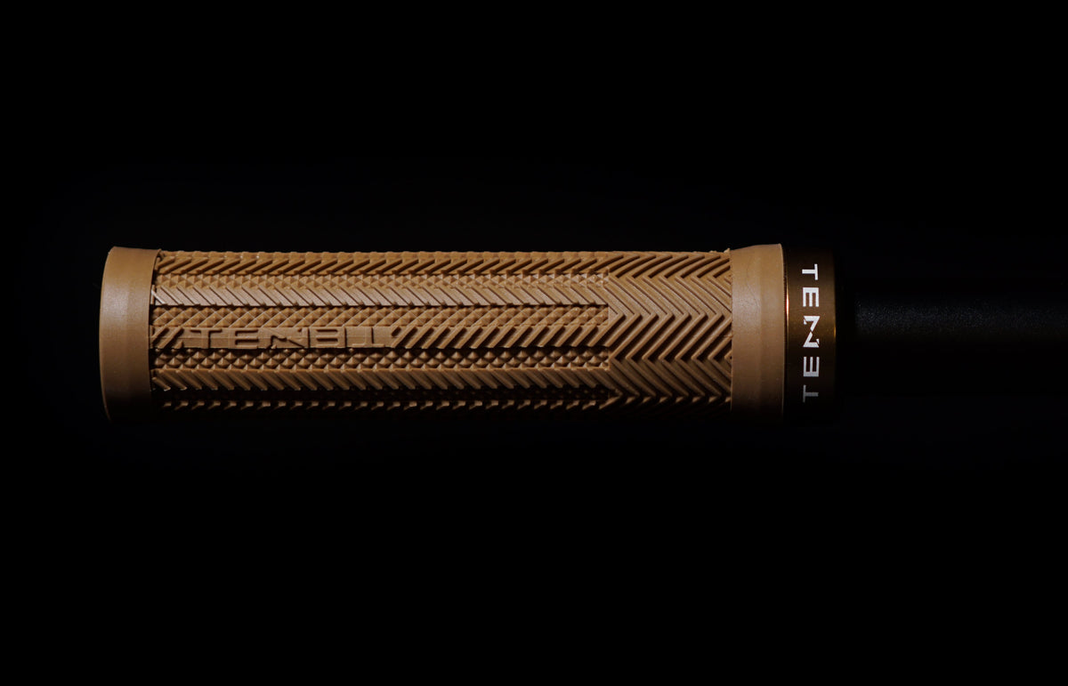 Close-up of the raised ribs and lower-profile knurled zones on a Tenet Icon Grip