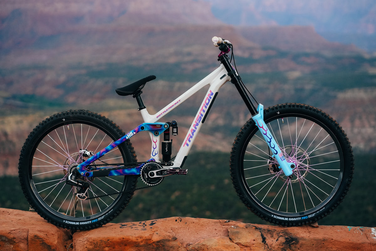Side view of Hannah's Bottlerocket with blue and pink paint and flames on the fork.