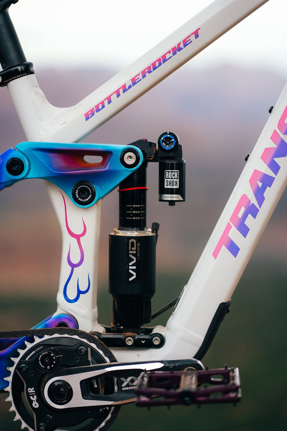 Flames painted on the seat stay beside the RockShox Vivid shock.