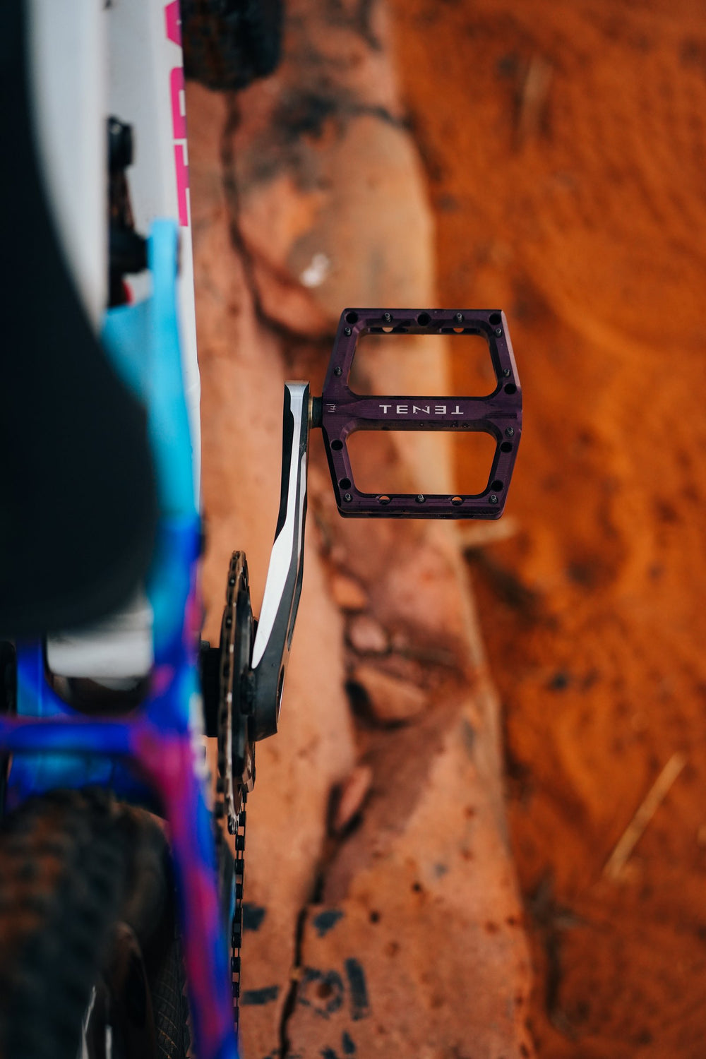 Purple Tenet pedal on Hannah's bike, seen from above.
