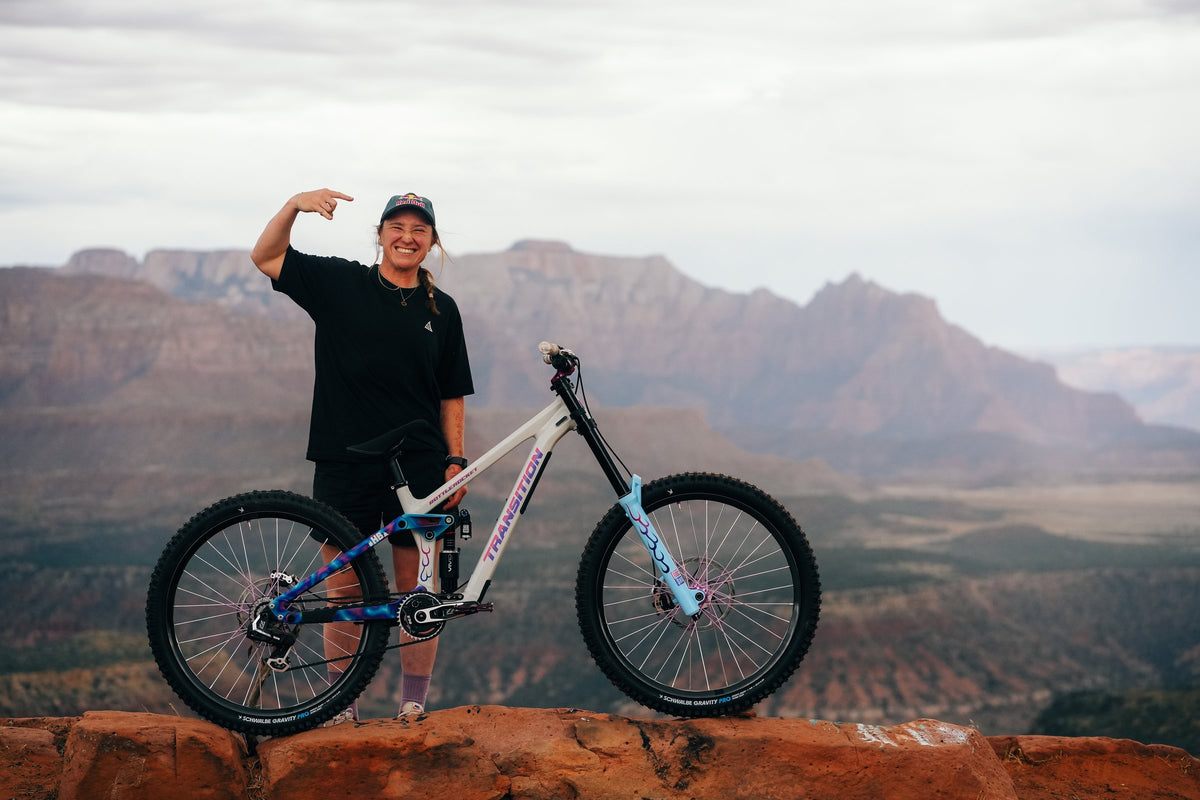 Hannah Bergemann shows off her bike above the canyon.