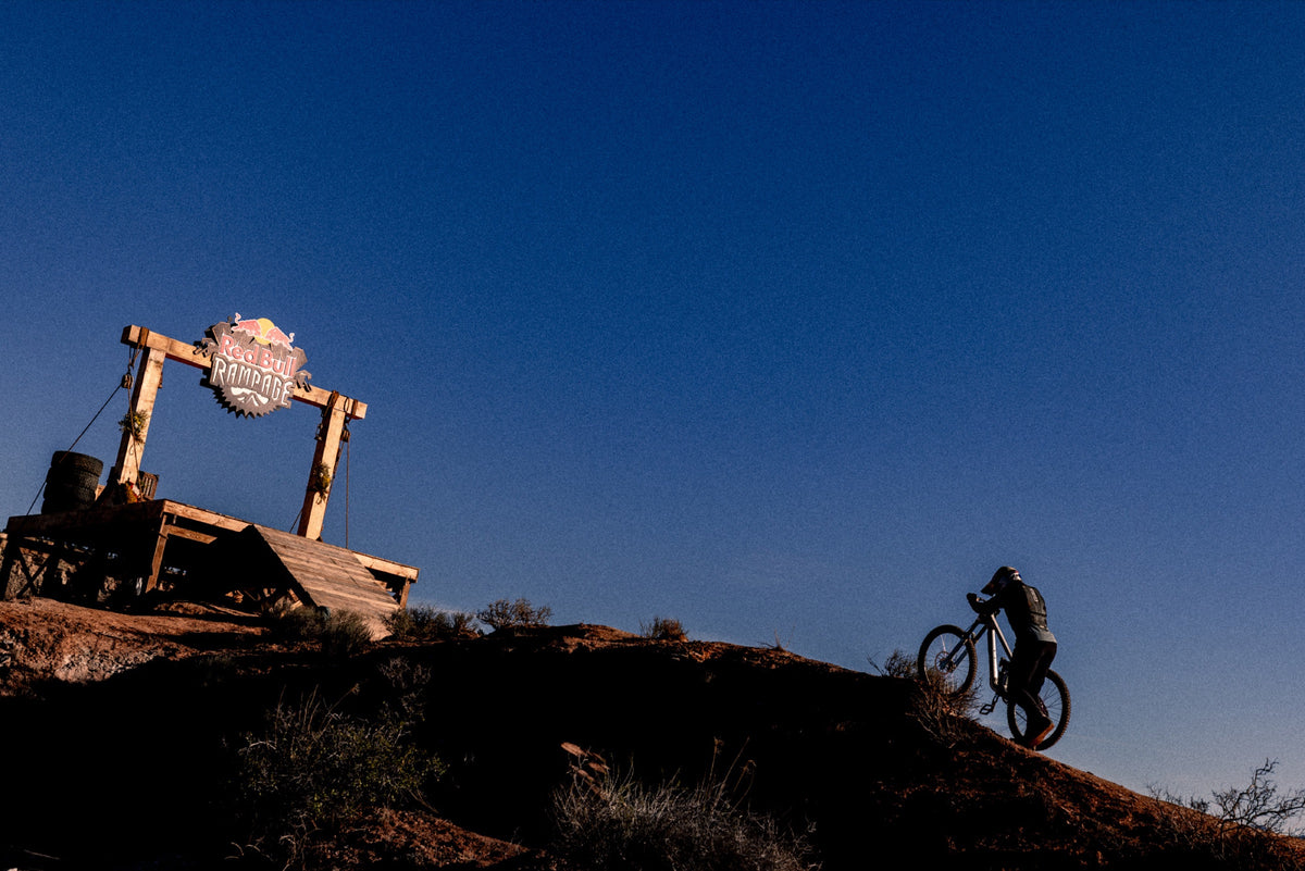 A rider passes the Rampage start gate in the blue light before sunrise. Photo: Robin O'Neill.