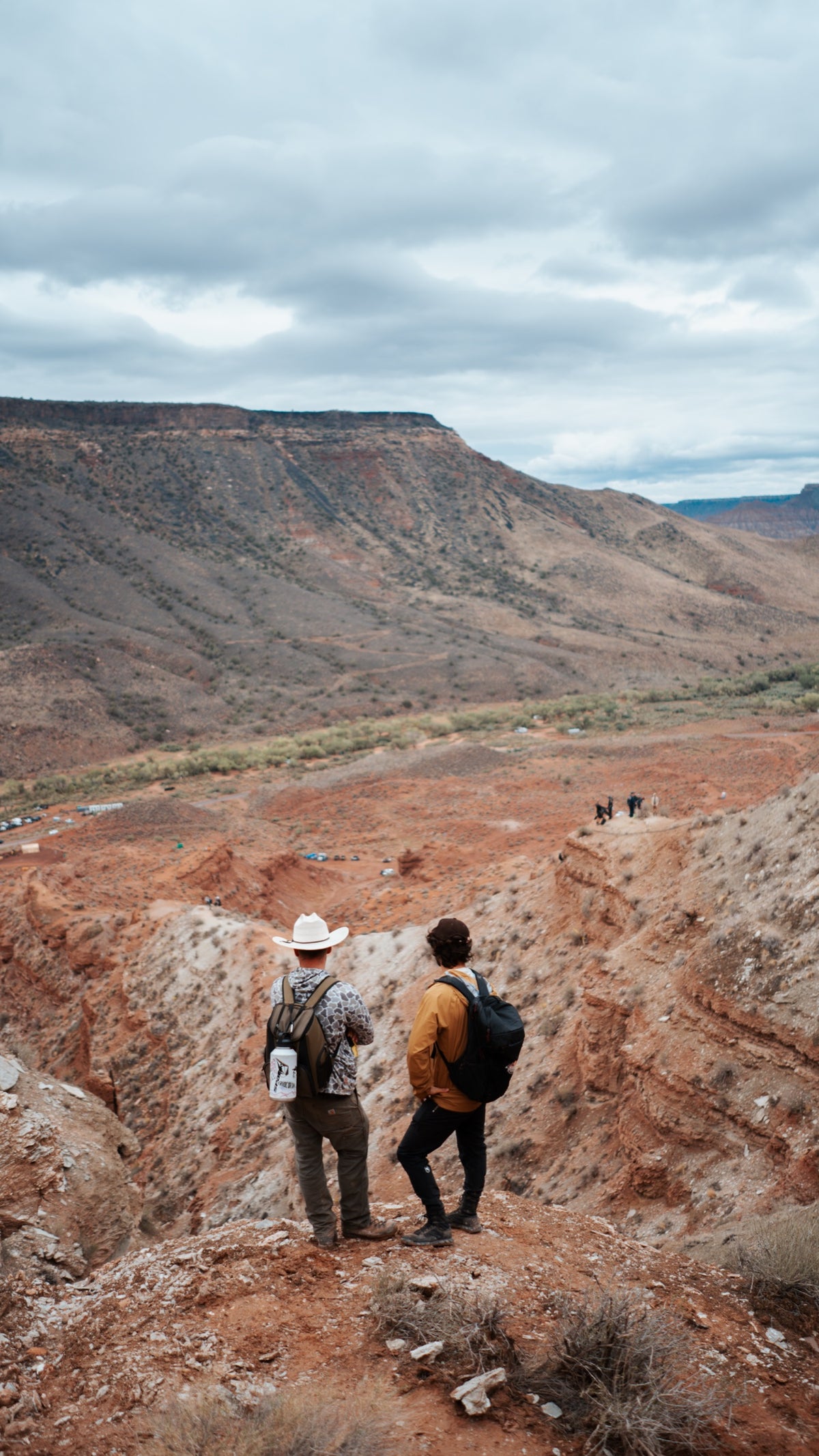 Two riders scout the mountain.